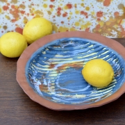 Rustic blue terracotta fruit bowl with lemons