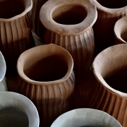 Raw clay flower vases waiting for bisque firing